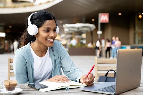 Photo of a female graduate student using a laptop